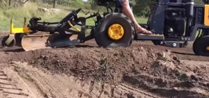 Tractor and Soil Scraper