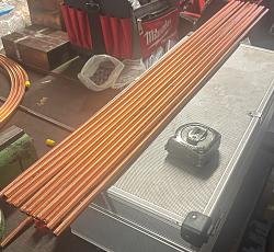 Adjustable coiled tube straightening tool-fire-tubes.jpg