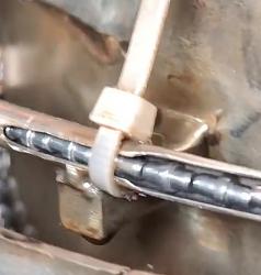 Chainsaw chain manufacturing - GIF-ziptie.jpg