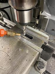 cutting solid rivets to correct length to form button heads-clearing-chain-drilling.jpg