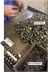 Factory worker putting washers on bolts - GIF-pile-bolts.png