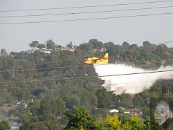 Fire bomber dumping retardant close to hillside - GIF-fire-9-3-09-5.jpg