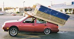 Loading a boulder onto a pickup truck - GIF-lumber_car_feature.jpg