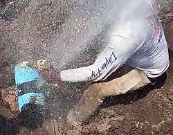 Water main bursts in plumber's face - GIF-ms3.jpg