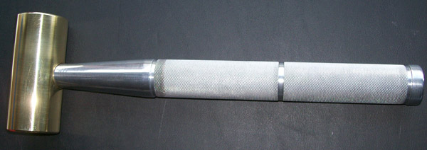 Brass hammer with 1-3/4 diameter head.