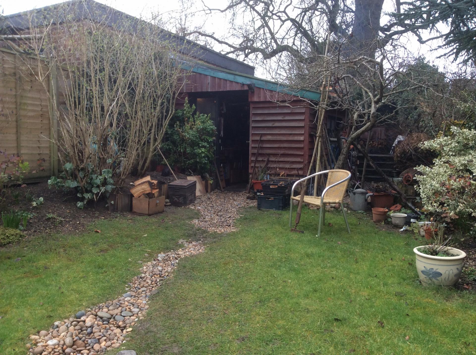 Lean-to against neighbour's garage